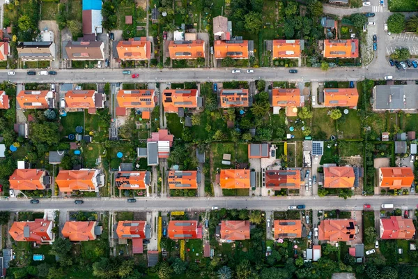 Top view of the city streets, red roofs of houses, urban landscape