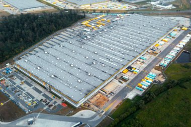 Aerial view of many modern industrial warehouses. Logistics center of the online store