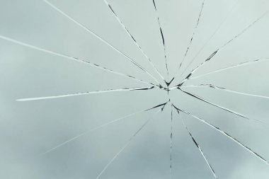 Crack on the glass against the sky, broken glass