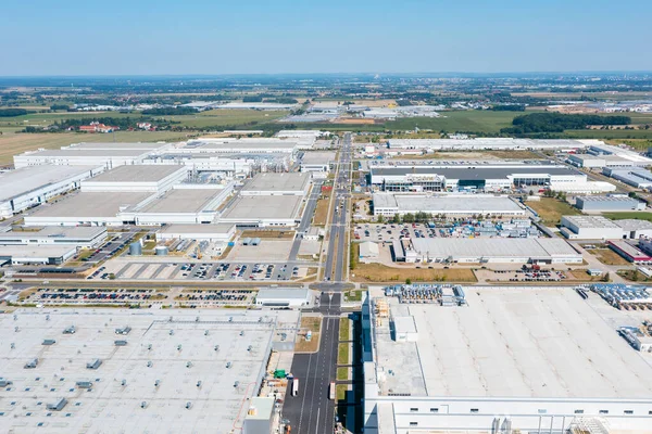 Aerial view of industrial area with many industrial buildings, consumer electronics factory