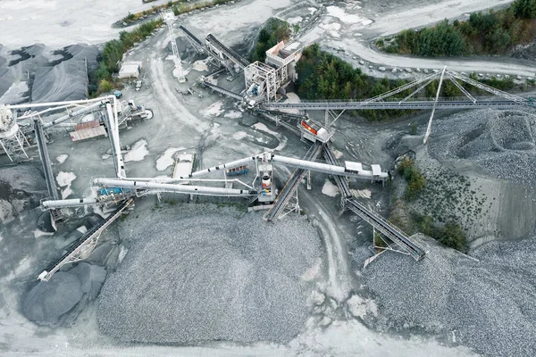 Aerial view of quarry, stone crusher, stone sorting conveyor belts, heavy industry