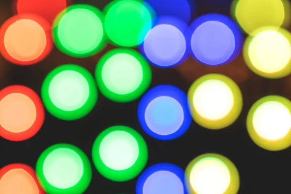 Lâmpadas Multicoloridas Brilhantes Fora Foco Para Fundo Fundo Natal — Fotografia de Stock