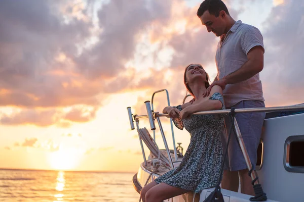 Loving couple spending time on a yacht at the sea — Stock Photo, Image