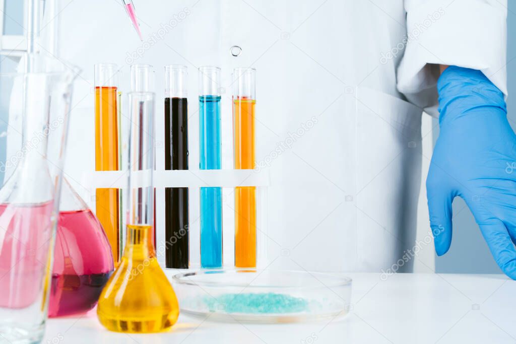 Scientist working with chemical samples in laboratory close up