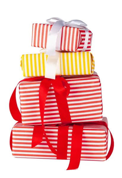 Colorful stacked gift boxes isolated on white background — Stock Photo, Image