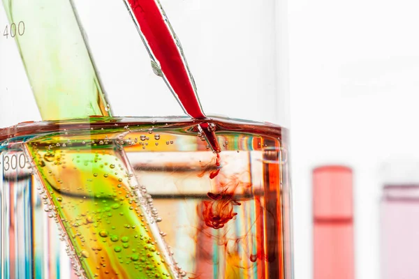 Test tubes with colorful chemicals close up in laboratory — Stock Photo, Image