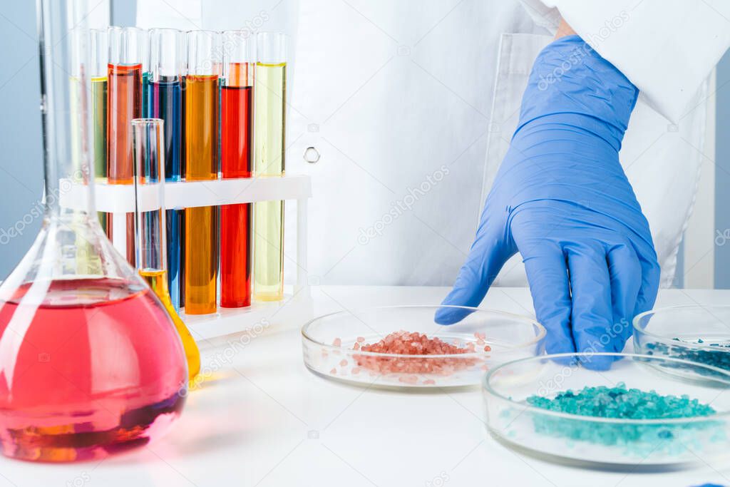 Scientist working with chemical samples in laboratory close up