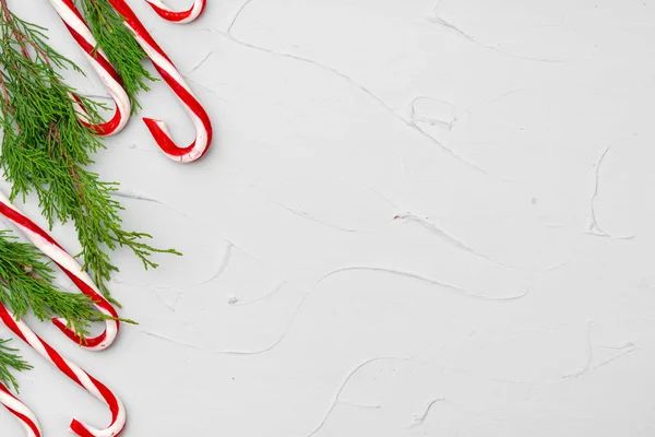 Vánoční přání pozadí s cukrovou třtinou, kopírovat prostor — Stock fotografie