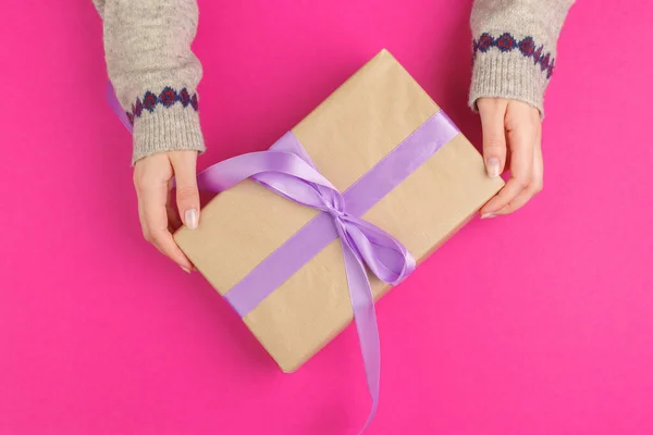 Small gift box in female hands, view from above — Stock Photo, Image