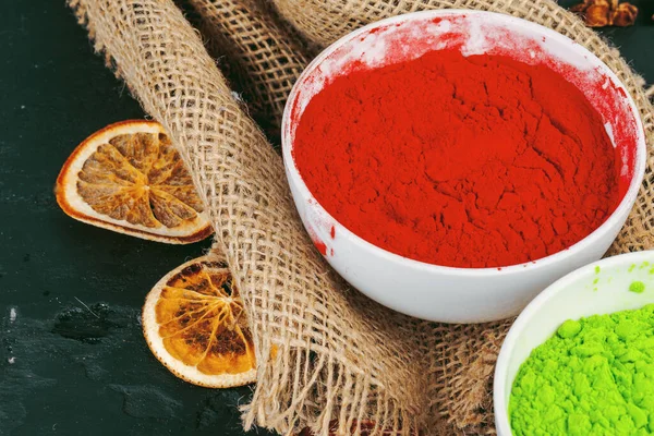 Traditional Indian Holi colours powder, spices on dark rustic background — Stock Photo, Image