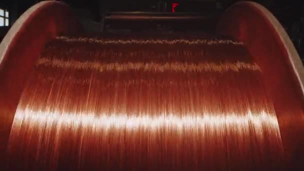 Spinning coil with copper cable in cable plant, close-up — Stock Video