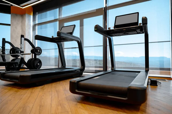 Studio shot of a professional treadmill in modern gym — Stock Photo, Image