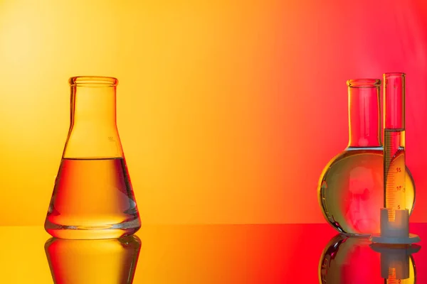 Science concept. Glass test tubes on red background — Stock Photo, Image