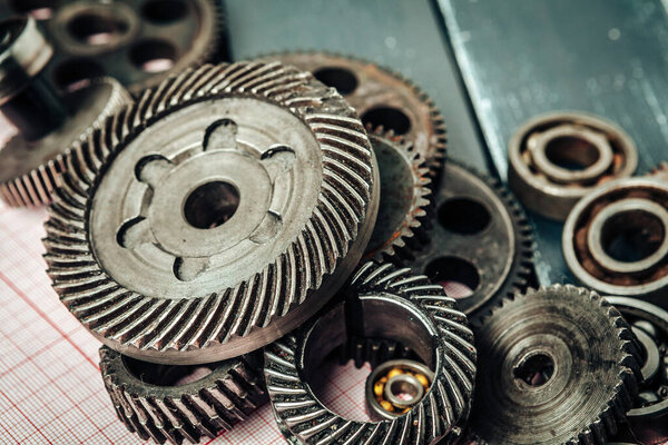 Car parts on graph paper close up. Engineering concept