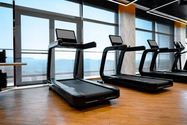Studio shot of a professional treadmill in modern gym — Stock Photo, Image