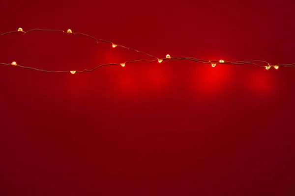 Abstraktní vánoční světla věnce na tmavém pozadí — Stock fotografie