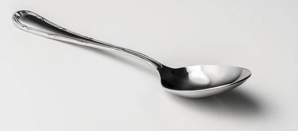 Ezüst desszert kanál evőeszközök szürke háttér — Stock Fotó