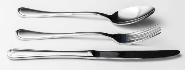 Spoon, fork and knife on a white background — Stock Photo, Image