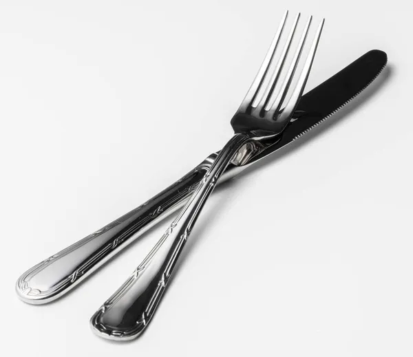 Tenedor y cuchillo aislados sobre fondo blanco —  Fotos de Stock