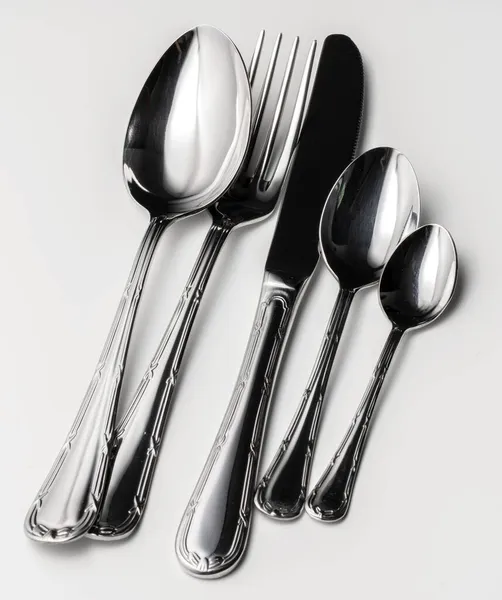 Set of silver cutlery on a white background — Stock Photo, Image