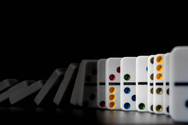 Domino game. Dominoes on a black table — Stock Photo, Image