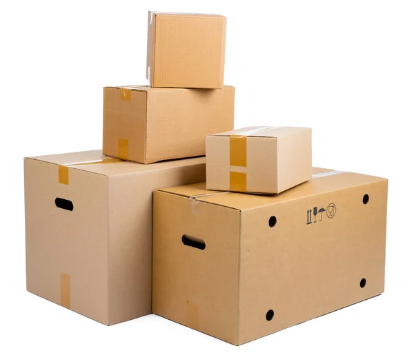 Stack of cardboard boxes isolated on white background — Stock Photo, Image