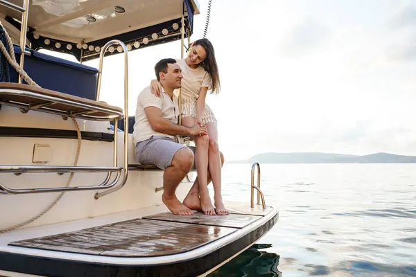 Loving couple spending time on a yacht at the sea — Stock Photo, Image