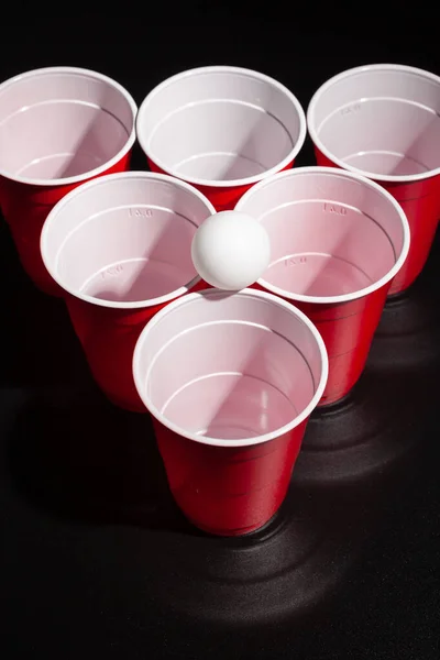Beer pong college game on black background — Stock Photo, Image