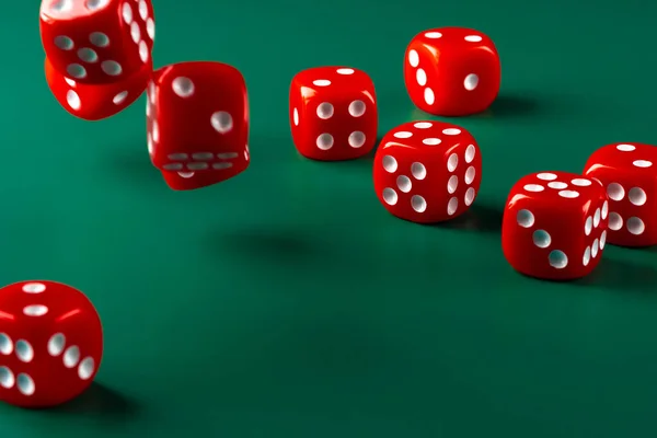 Red dice on green background close up — Stock Photo, Image