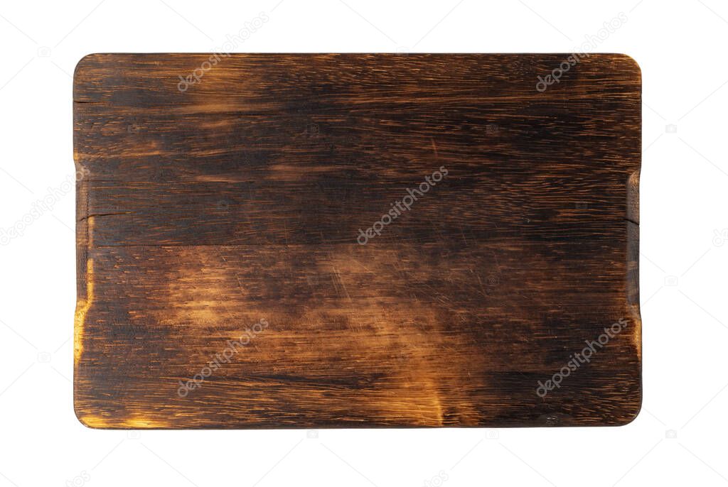 Dark wooden cutting board on white background