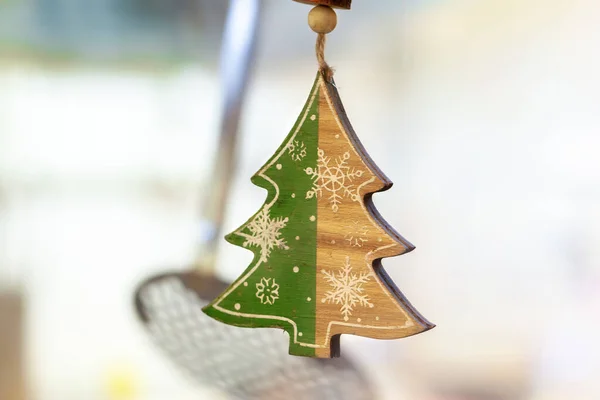 Christmas decorative wooden pendant in interior close up — Stock Photo, Image