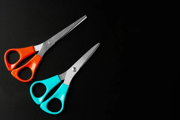 Scissors close up on dark black background — Stock Photo, Image