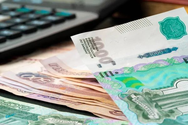 Close up photo of stack of Russian money rubles with calculator — Stock Photo, Image