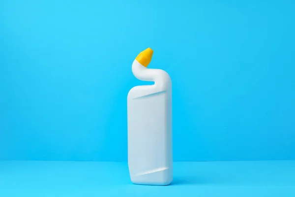 Liquid detergent for toilet cleaning on a blue background — Stock Photo, Image