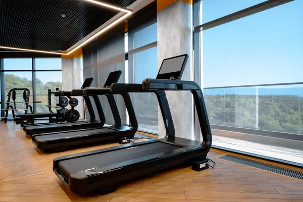 Studio shot of a professional treadmill in modern gym — Stock Photo, Image