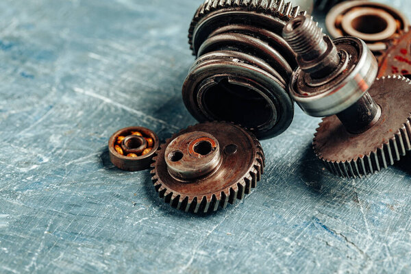 Close up of old rusty car parts on dark background