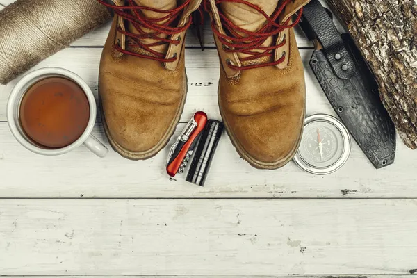 Hiking boots, compass and knife. Hiking outdoor equipment — Stock Photo, Image