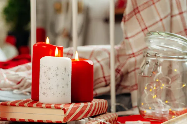 Red and white Christmas candles interior decoration — Stock Photo, Image