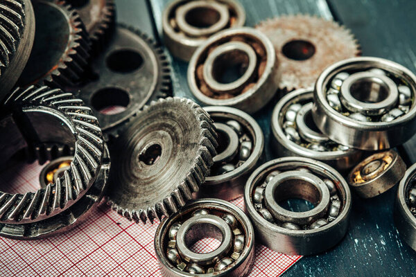 Car parts on graph paper close up. Engineering concept