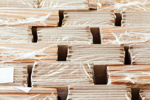 Cardboard sheets pack on a shelf of warehouse — Stock Photo, Image