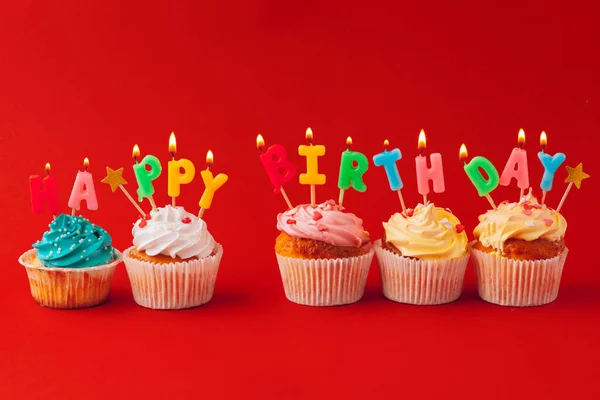 Happy birthday cupcakes on bright colored background — Stock Photo, Image