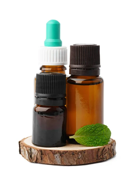 Essential oil in a small bottle with green leaf on white background — Stock Photo, Image