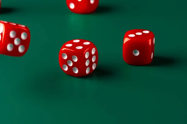 Red dice on green background close up — Stock Photo, Image