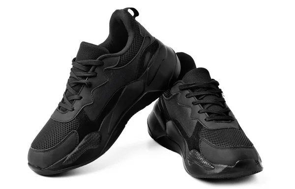 白色背景的新黑色运动鞋 — 图库照片