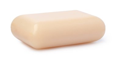 Beyaz arkaplanda izole edilmiş tek sabun çubuğu