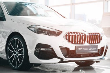 KRASNODAR, RUSSIA - NOVEMBER 19, 2020: White BMW Series 2 Gran Coupe in car showroom