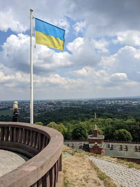 Flag of Ukraine on the viewing platform of Kociuszko Mound, Krakow, Poland