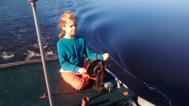 Child Girl Driving Motor Boat Drives River — Stock Video