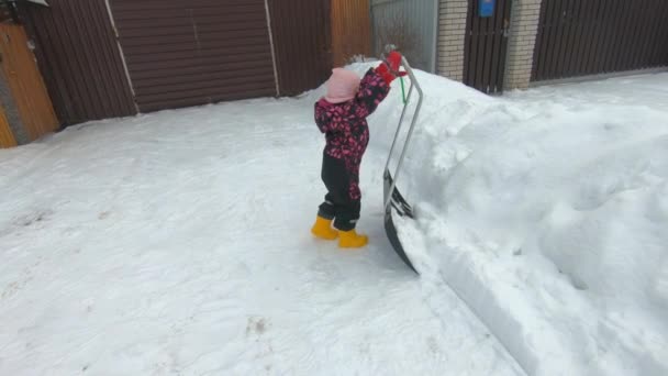 Girl Child Cleans Snow Shovel Worker Assistant — Stok video