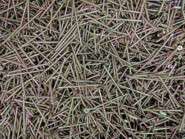 Geliştirilmiş ve güçlendirilmiş tahta vidalarının arka planı veya dokusu